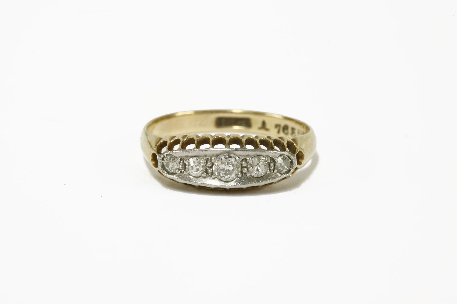 An Edwardian gold five stone graduated diamond boat shaped ring, marked 18ct and Plat 2.87g