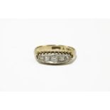 An Edwardian gold five stone graduated diamond boat shaped ring, marked 18ct and Plat 2.87g