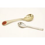 A cased silver spoon by George Jensen, with enamel decoration and a modern silver coffee spoon,