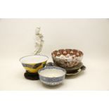 A collection of Chinese ceramics, including three blanc de Chine Guanyin and a pottery figure,