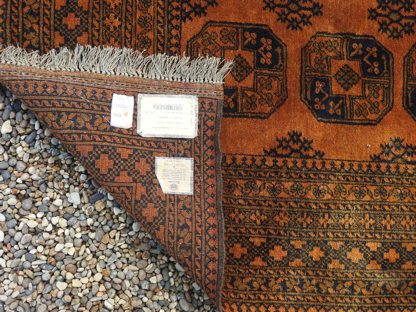 An Afghan rust ground rug, 265 x 202cm - Image 2 of 2