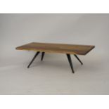 A modern oak coffee table of rectangular form, raised on tapered industrial style legs