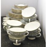 A substantial Wedgwood Fieldfare dinner service, the olive green ground heightened with white floral