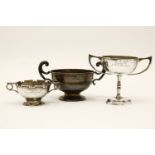 Three silver twin handled trophy cups, two engraved