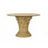 A circular composite and glass topped centre table, the base cast in the form of a Corinthian