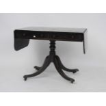 A Regency rosewood and cross banded sofa table, on turned support and quadripartite base, 97cm x