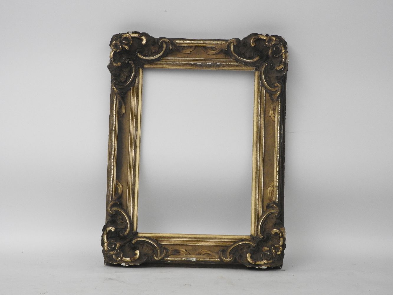 A 19th century giltwood and composition picture frame, with 'c' scroll detail,70 cm x 48 cm internal