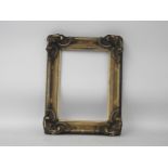 A 19th century giltwood and composition picture frame, with 'c' scroll detail,70 cm x 48 cm internal
