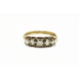 A gold five stone graduated diamond ring, with mixed cushion cut and old European diamonds3.20g