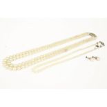 A single row graduated cultured pearl necklace, with a 9ct white gold clasp, a two row simulated