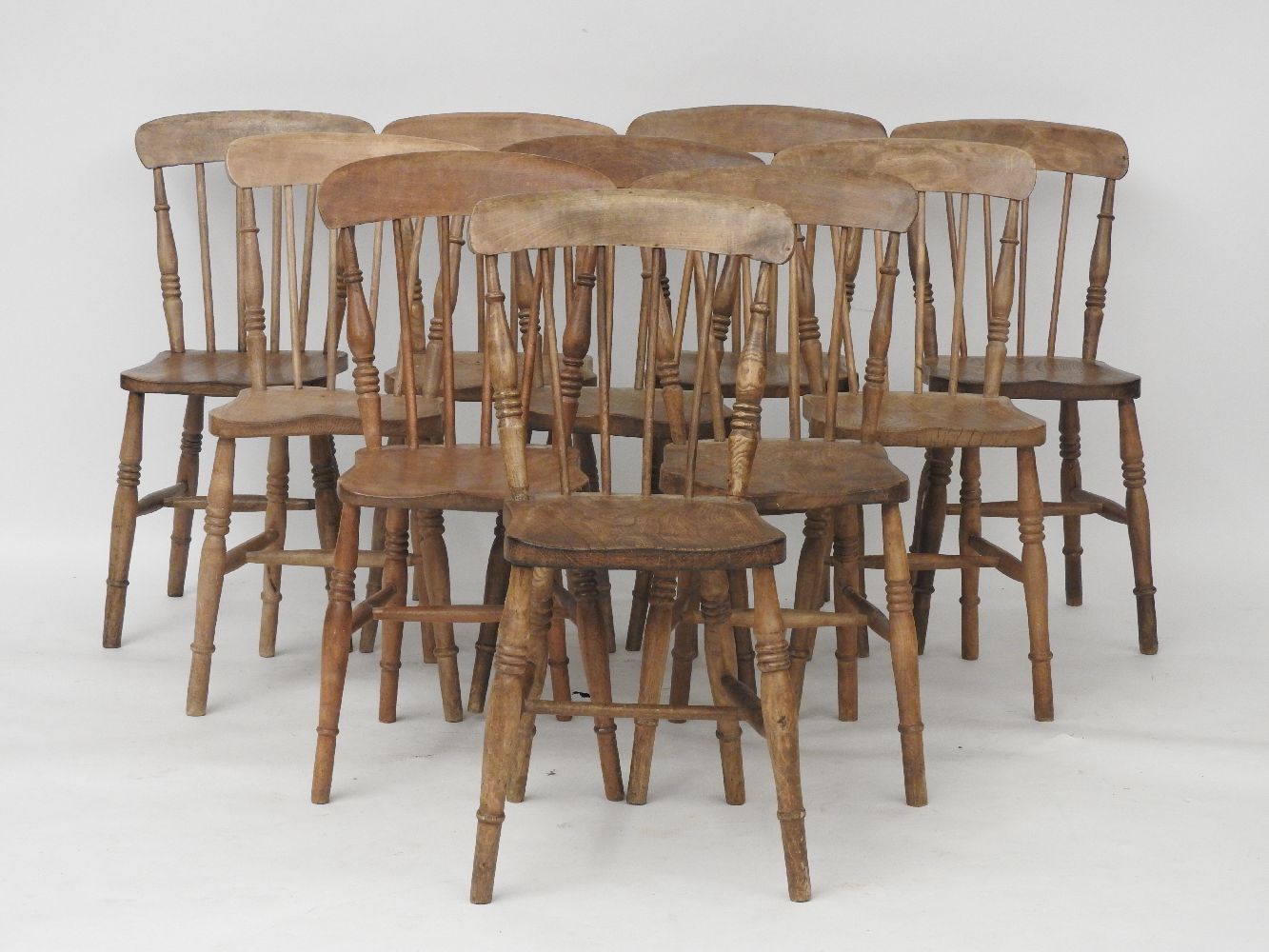 Ten matched spindle back kitchen chairs