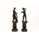 A pair of spelter figures of agricultural workers