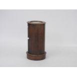 A cylindrical mahogany pot cupboard with inset marble top, 70cm tall, 37cm wide