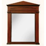 A Biedermeier design faux mahogany and ebonised over mantel mirror of architectural form, fitted