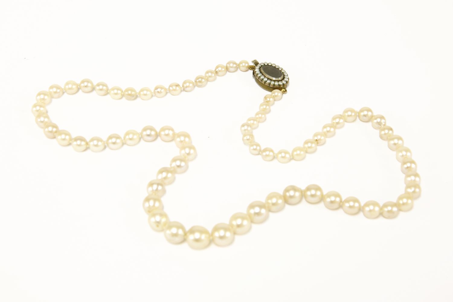 A single row graduated cultured pearl necklace, with replacement Georgian pearl and glazed