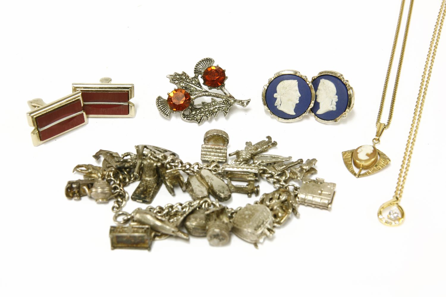 A silver charm bracelet with assorted silver charms, a collection of costume jewellery to include