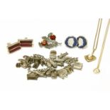 A silver charm bracelet with assorted silver charms, a collection of costume jewellery to include