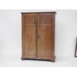 A 20th century mahogany wardrobe, possibly Heals, 120cm wide x 176cm high