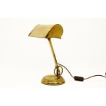 A modern brass desk lamp