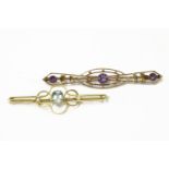 A gold oval cut blue paste and seed pearl bar brooch, marked 9ct, and an Edwardian two colour gold