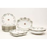 A Royal Doulton dessert service, printed with roses and oval medallions