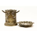 A pierced silver bottle sleeve, together with a lobed silver bon bon dish