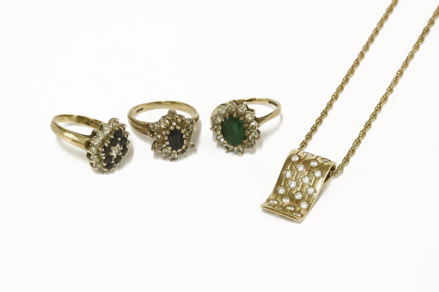 A 9ct gold sapphire and white stone ring, a 9ct gold green and cubic zirconia stone cluster ring,