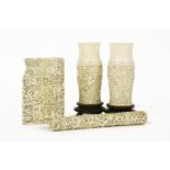 A Chinese ivory needle case, 16cm long, a card case, damaged, and a pair of vases, 10.5cm high (6)