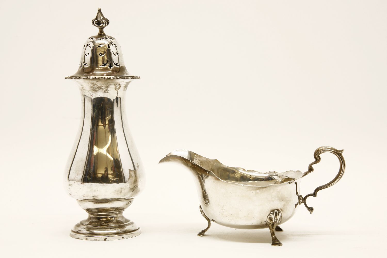A Mappin & Webb silver sugar caster, and a silver sauce boat