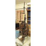 A 19th century oak spinning wheel