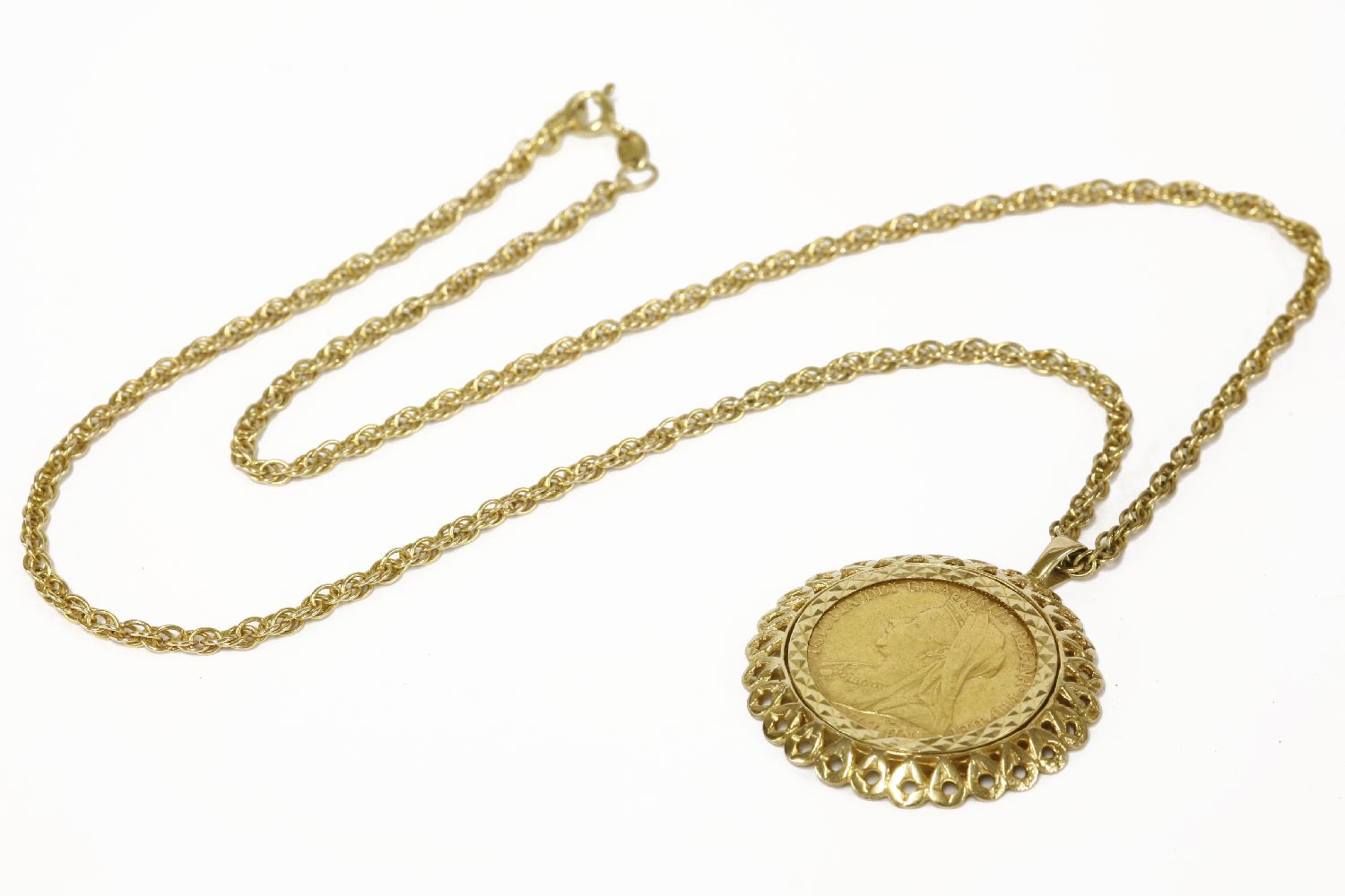 A gold sovereign dated 1898 in a 9ct gold mount, channel set on 9ct gold Prince of Wales chain18.