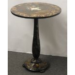 A Victorian circular black lacquer table, with painted flowers and gilt scrollwork58cm diameter