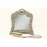 An early 20th century silver easle mirror, with shaped frame, marks for Birmingham, maker's mark for