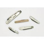 A 9ct gold folding penknife and four silver and mother of pearl fruit knives