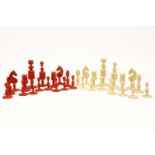A Washington pattern ivory chess set, the set comprising of natural and red stained pieces, the