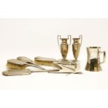 An Art Deco silver backed dressing table set together with a pair of spill vases with handles to