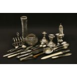 A silver castor, a pair of dwarf candlesticks, an ivory mounted paper knife and other items