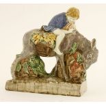 *A figure of a donkey eating carrots,by Stella Crofts (1898-1964), modelled in polychrome colours,