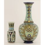 A Burmantofts faience pottery vase, the bulbous tubelined body with an elongated flared neck, in the