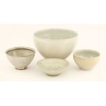 Gwyn Hanssen Pigott (Australian, 1935-2013),four bowls, three with central designs, the largest bowl