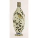 A Martin Brothers' stoneware vase,1884, of slender shape, incised with finches and a butterfly