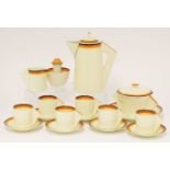 A Clarice Cliff part coffee set, each piece painted with concentric rings, comprising six cups and
