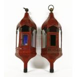 A pair of Moorish hanging lanterns, each of hexagonal form with clear and coloured glass panels,