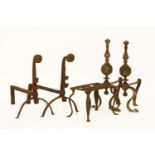 A pair of wrought iron andirons, 39cm high and another pair and an iron trivet