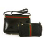 A Gucci vintage black leather handbagwith techno canvas banding and gold-tone hardware, anda Gucci