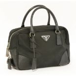A Prada Milano black canvas tote handbag,with saffiano trim, looping handles and silver-tone