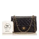 A Chanel classic medium lambskin double flap shoulder bag, with a black quilted lambskin leather