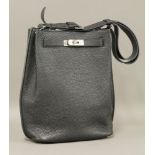 An Hermès 'So-Kelly 22' bag,in black Togo calfskin, zip front pocket, adjustable strap, embossed '