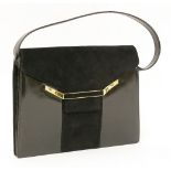 A Christian Dior black leather clutch bag,with white metal clasp and logo engraved 'Dior',