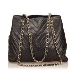 A Chanel chevron lambskin chain tote,the 11.12 tote features a black chevron lambskin body, gold-